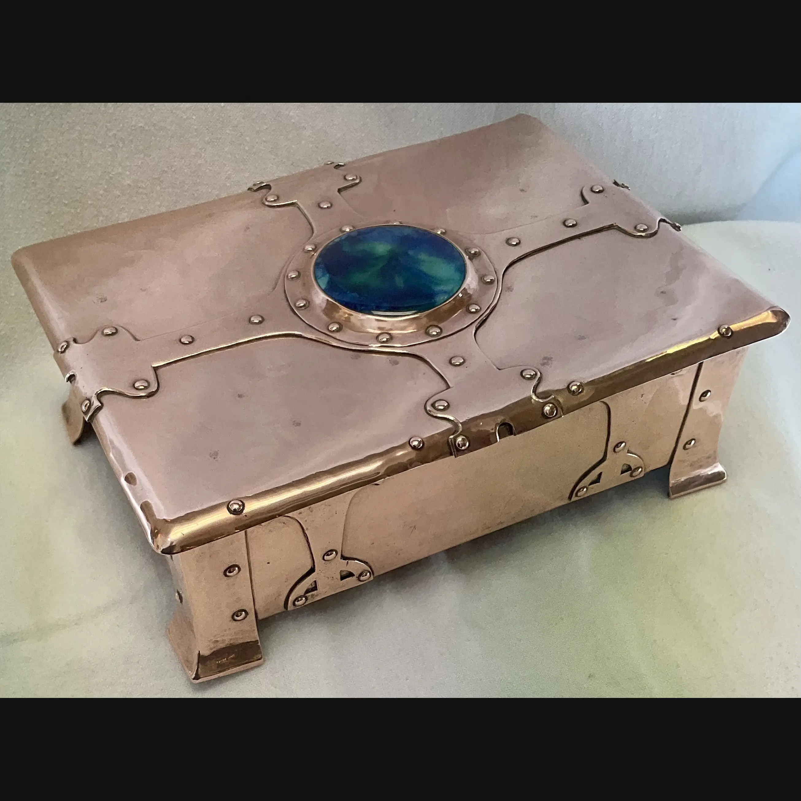 a e jones large arts and crafts copper strap topped casket with ruskin cabochon and  clasp