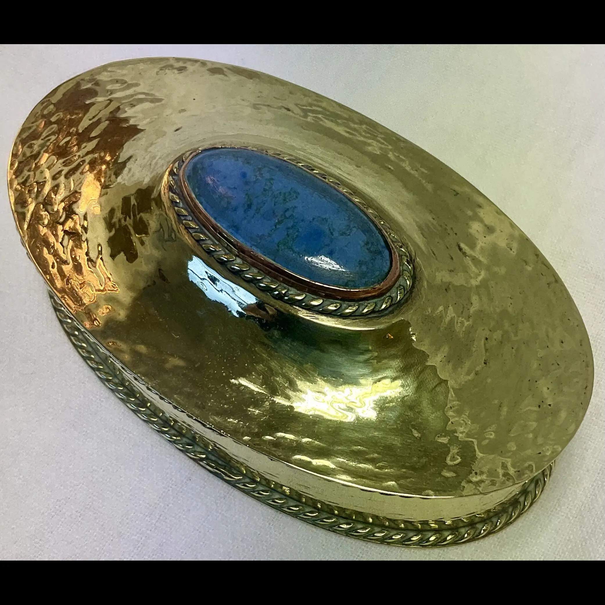 arts and crafts hammered brass oval box with wire work mounted ruskin cabochon