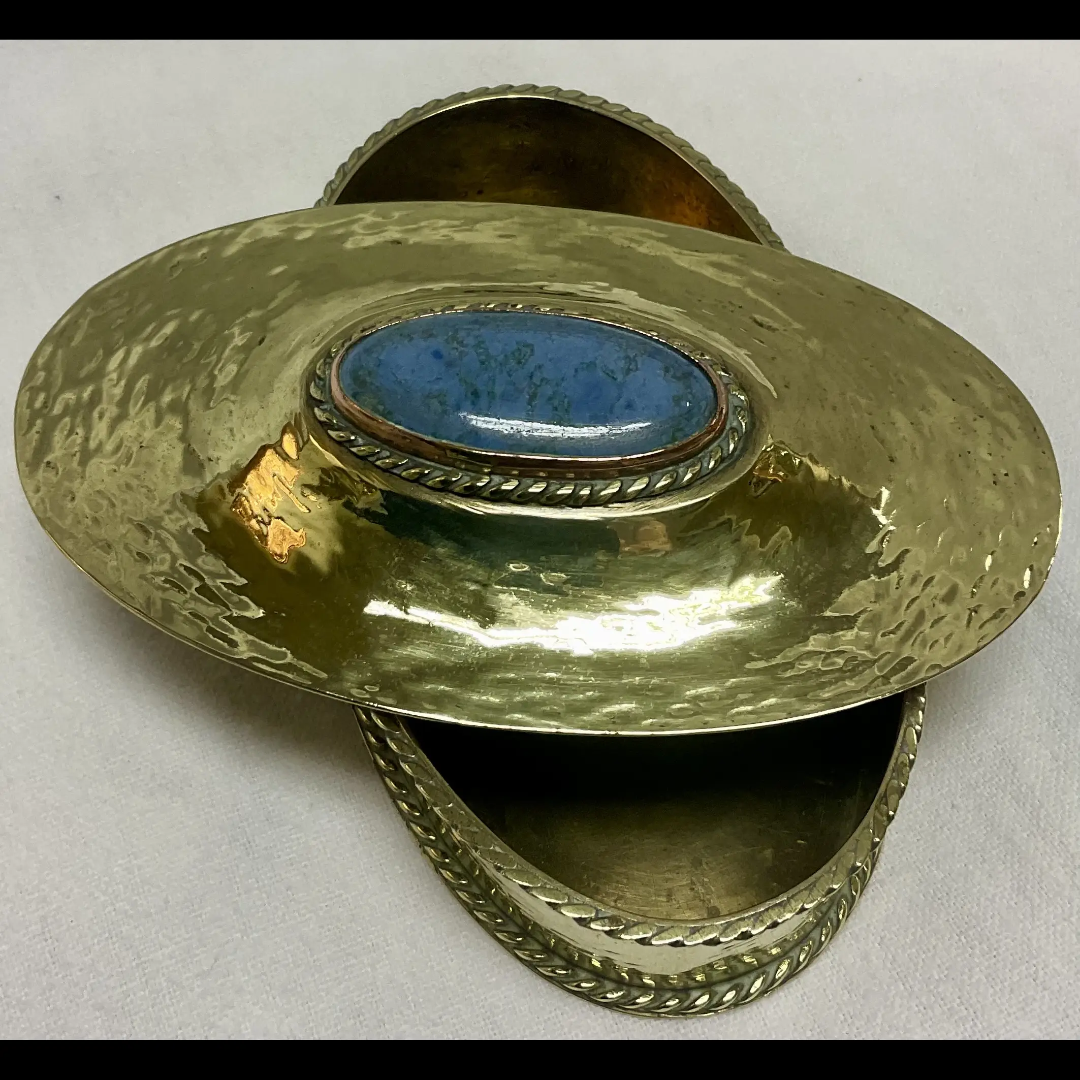 arts and crafts hammered brass oval box with wire work mounted ruskin cabochon