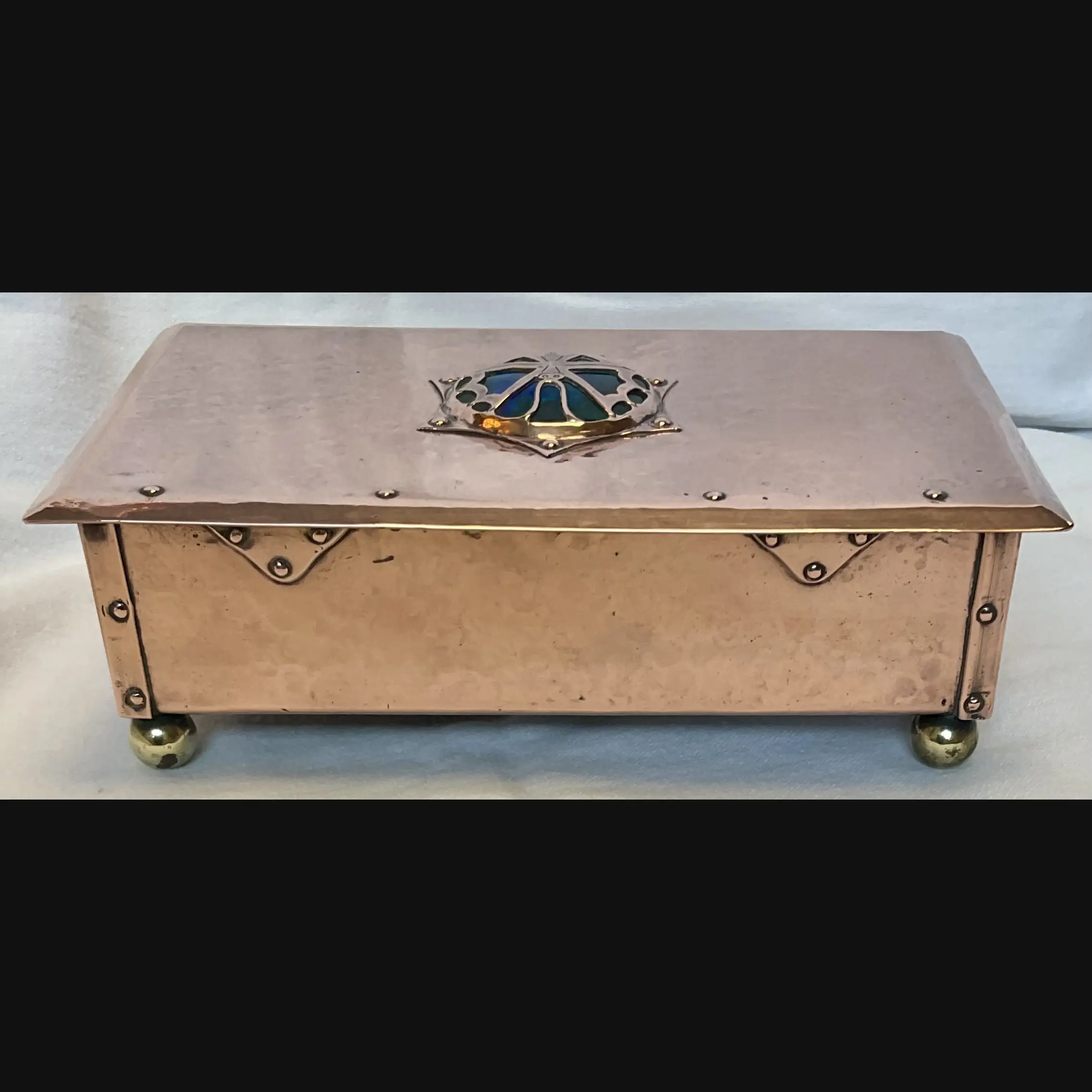 cambray ware best and lloyd arts and crafts copper casket with butterfly covered enamelled cabochon