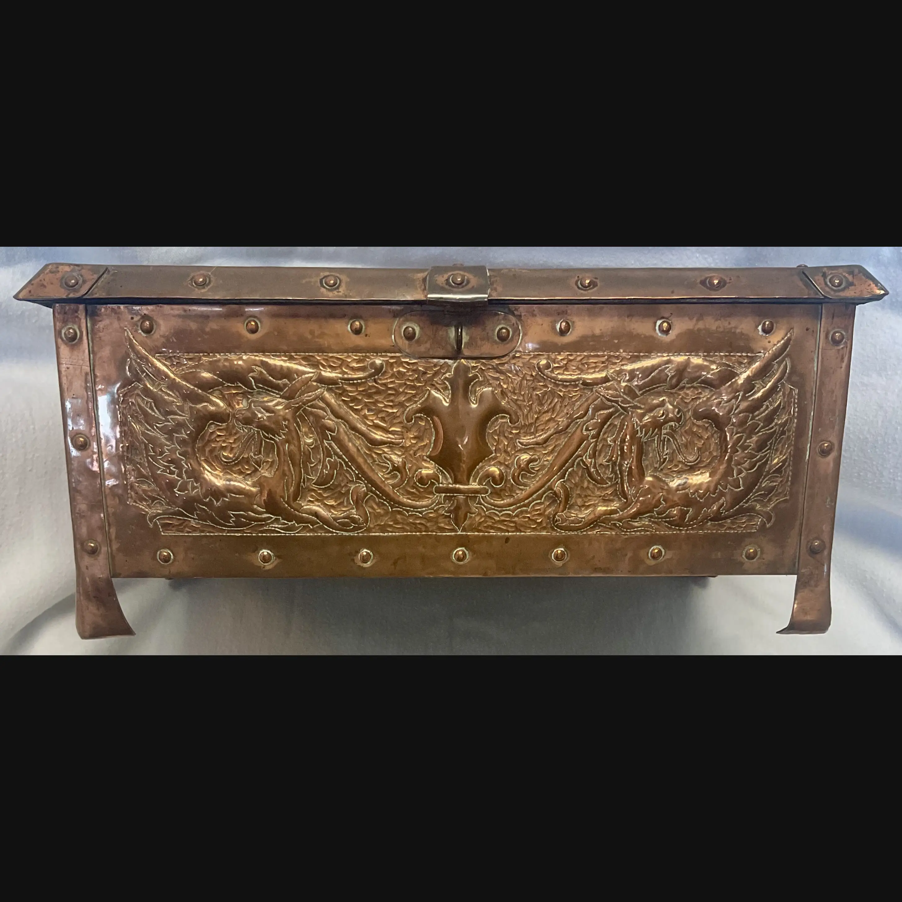 large arts and crafts copper jewel casket with grotesques and griffens velvet lined c1910