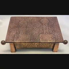 j f pool hayle copper strap topped casket with tapered feet in their secessionist manner