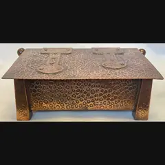 j f pool hayle copper strap topped casket with tapered feet in their secessionist manner