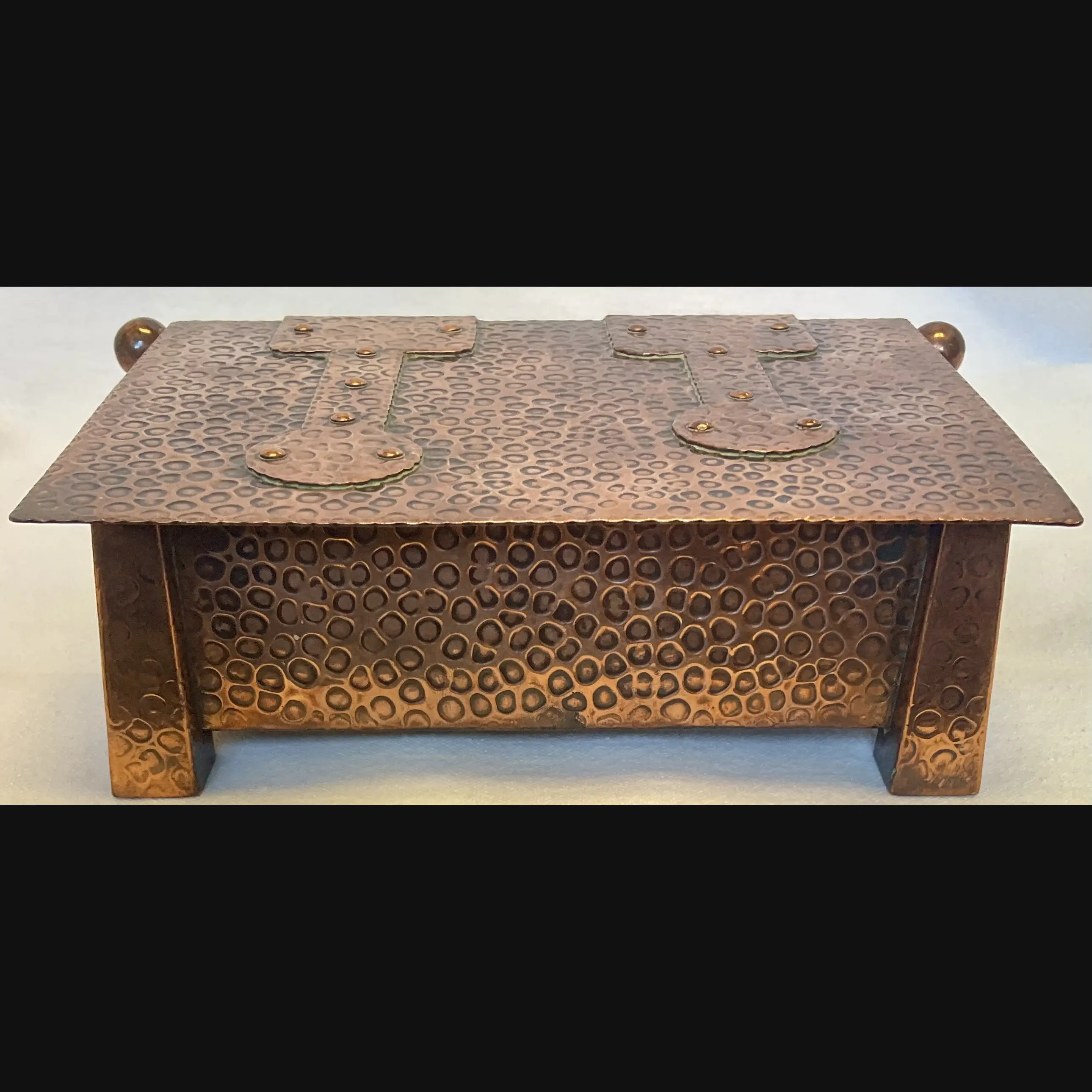 j f pool hayle copper strap topped casket with tapered feet in their secessionist manner