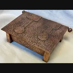 j f pool hayle copper strap topped casket with tapered feet in their secessionist manner