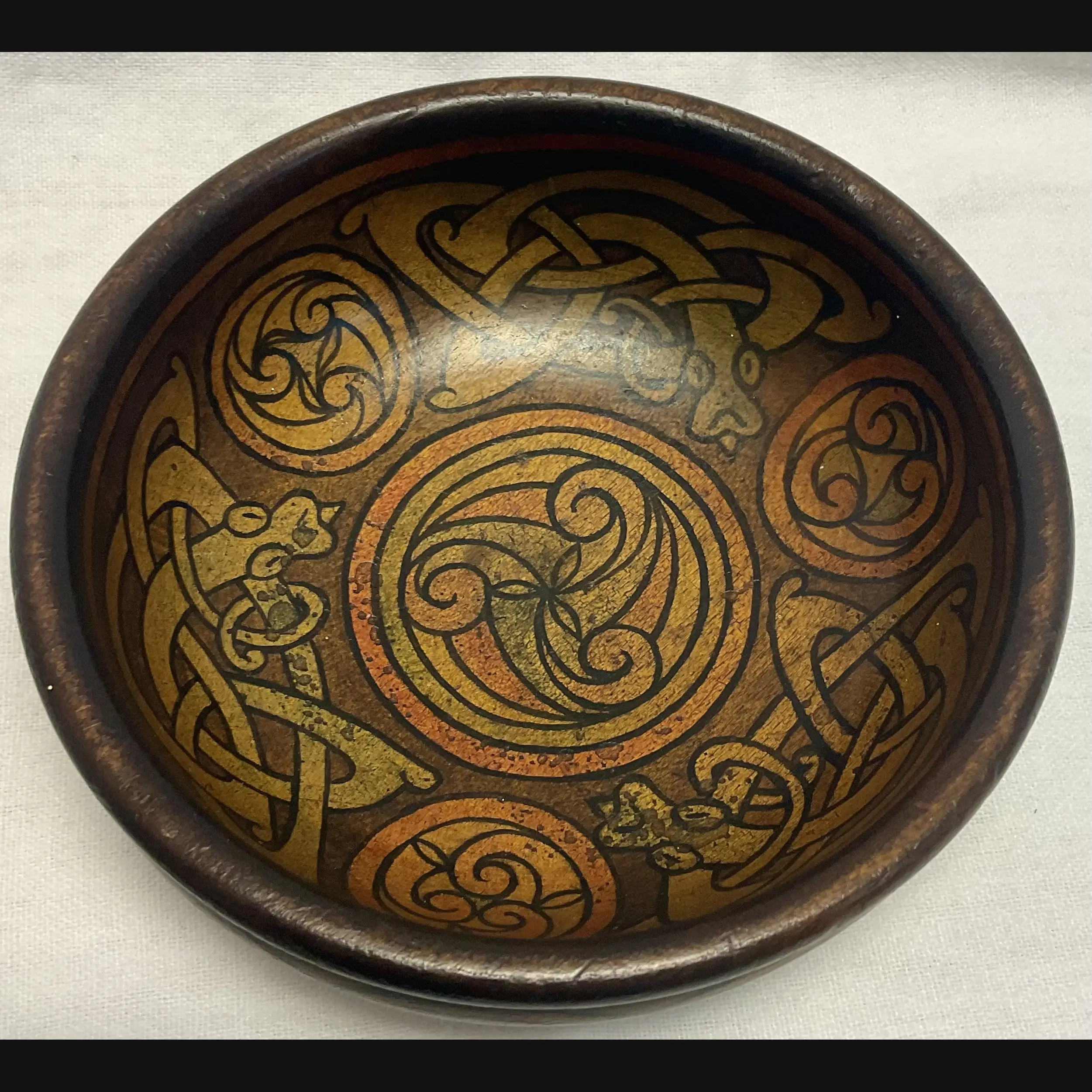 irish arts and crafts celtic mythical beasts pen work bowl in the manner of the belfast school eva mackay c1900