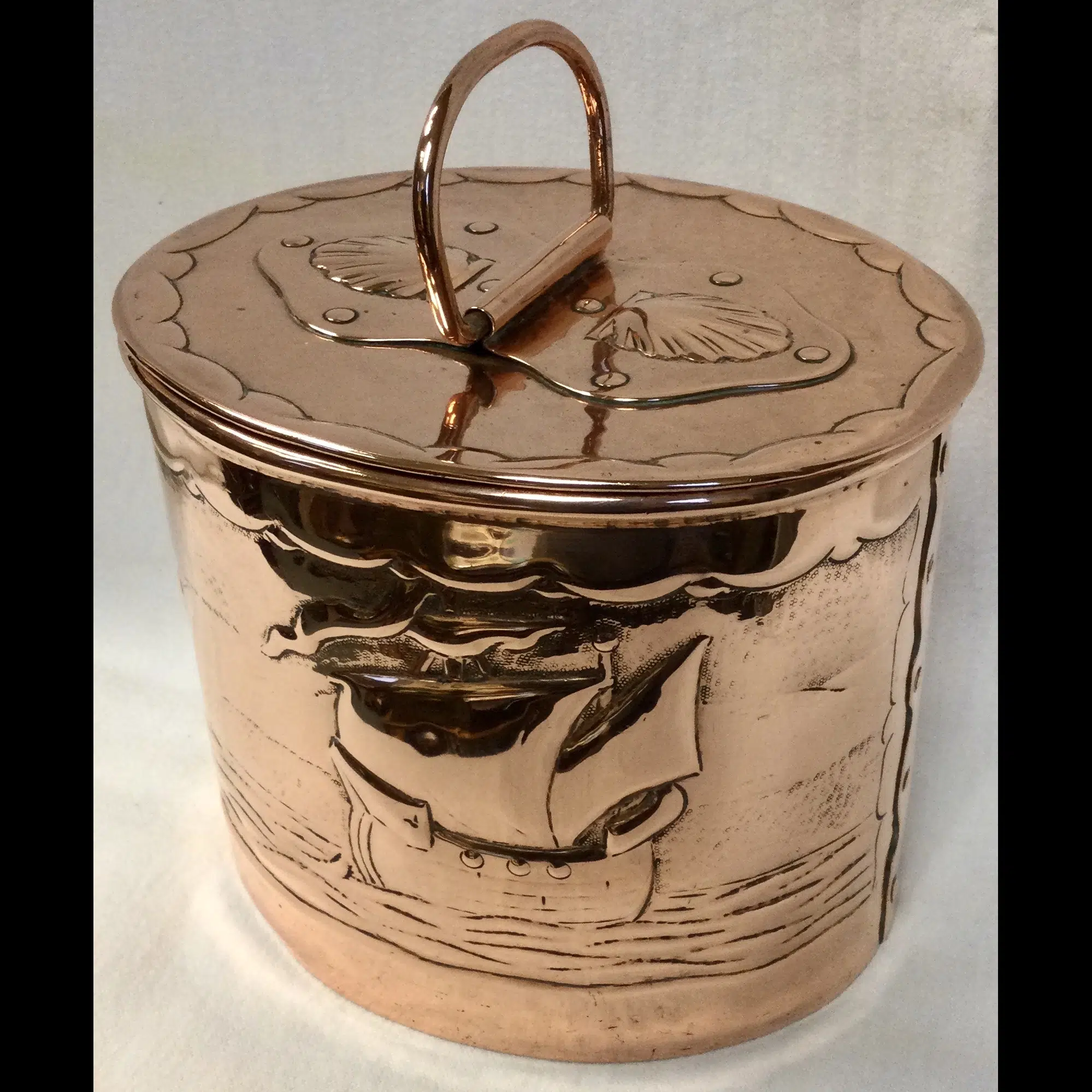 newlyn copper biscuit box with masted ships