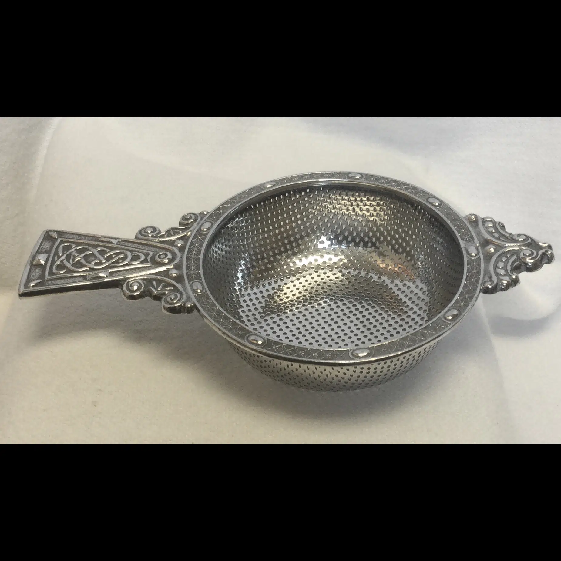 a.e.jones silver celtic scrolls tea strainer